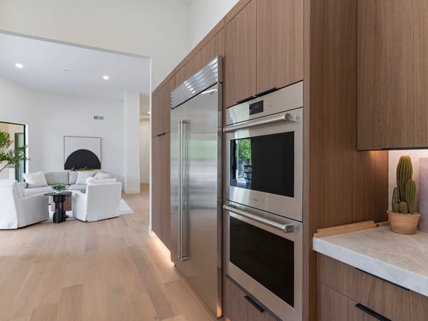 High-end custom cabinetry surrounding built-in premium appliances provides exceptional storage and a sleek modern aesthetic. Every detail reflects the quality craftsmanship found throughout this Scottsdale home.