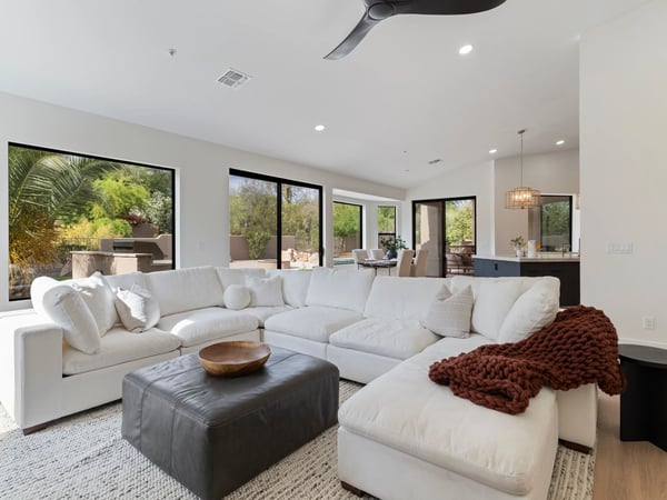 Open great room seamlessly connecting the kitchen, dining area, and outdoor living spaces. Bright natural light and contemporary finishes create a welcoming atmosphere throughout this Scottsdale home.