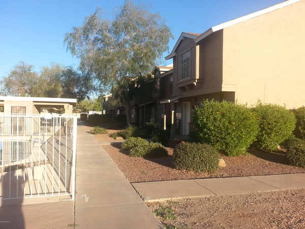 Community grounds feature mature shade trees, attractive desert landscaping, and open spaces that contribute to a relaxing residential environment.