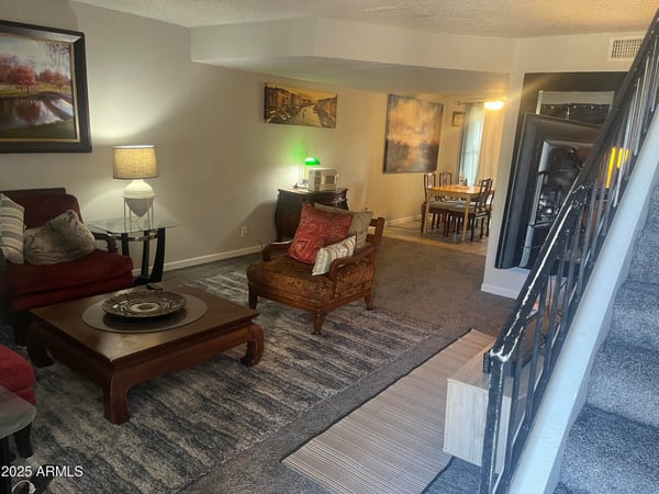 Spacious living area features a functional floor plan with comfortable gathering space that flows naturally into the dining room and kitchen.