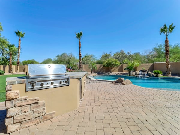 Relax beside the sparkling pool while enjoying the built-in barbecue, waterfall feature, paver patio, and beautifully landscaped backyard. This Glendale home offers resort-style outdoor living at its finest.