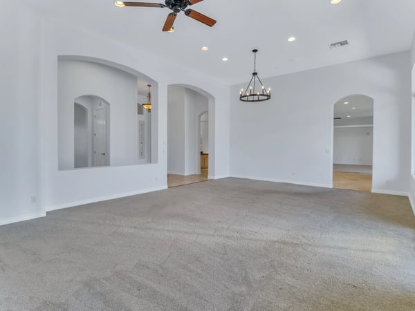 The open great room features impressive ceiling height, recessed lighting, architectural niches, and seamless flow into adjoining living areas. An inviting gathering space in this beautifully maintained Glendale home.