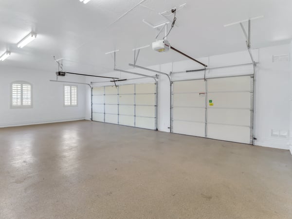 This finished three-car garage features epoxy flooring, automatic openers, bright overhead lighting, and plenty of room for vehicles, storage, or hobbies. A standout amenity in this Glendale property.