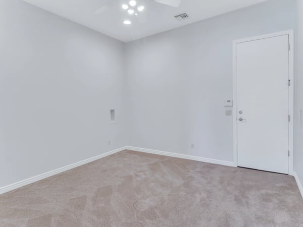 Flexible room with plush carpeting, neutral finishes, recessed lighting, and private access. Perfect as a home office, exercise room, craft room, or guest suite in this Glendale residence.