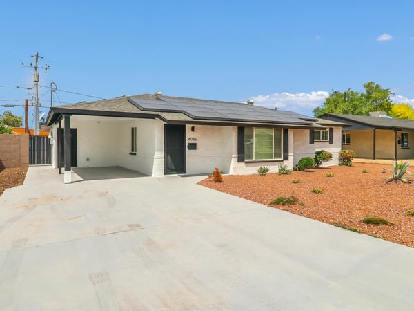 Covered front entry and spacious carport create a welcoming first impression while offering convenient protected parking. This updated Phoenix rental combines modern improvements with classic ranch-style charm.