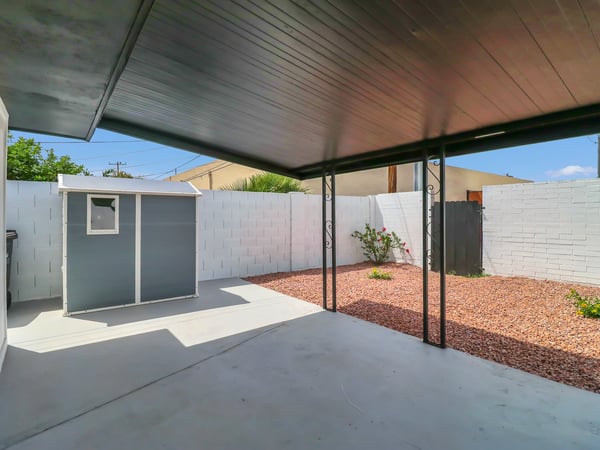 Relax beneath the covered patio while enjoying the low-maintenance backyard with decorative landscaping, storage shed, and private outdoor space. An ideal extension of this beautifully updated Phoenix rental, complete with a resurfaced pool for year-round enjoyment.