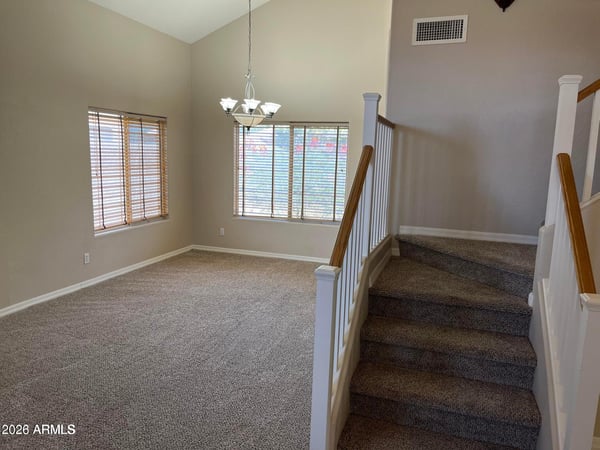 Make a lasting first impression with soaring ceilings, elegant staircase railings, oversized windows, and an open foyer that fills the home with natural light.