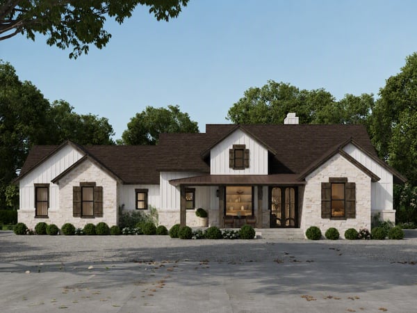 Spacious single-story home featuring unique architecture and a welcoming front porch amidst lush landscaping.