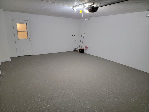 Spacious garage with a clean, open layout, perfect for storage or parking vehicles.