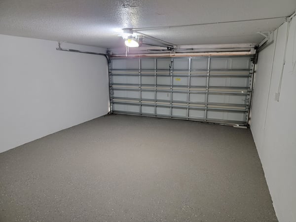 Spacious garage with a smooth floor, ideal for vehicles or additional storage solutions.