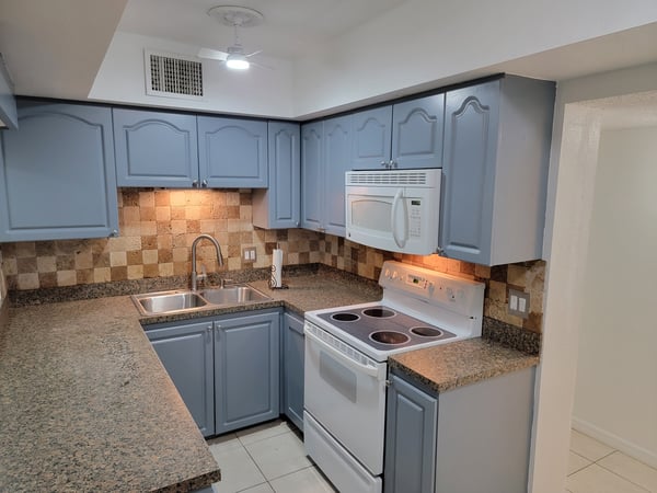 Bright and functional kitchen featuring modern appliances and ample counter space for culinary enthusiasts.