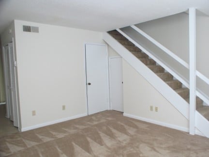 Spacious living area featuring neutral tones, ideal for easy personalization and comfortable living.