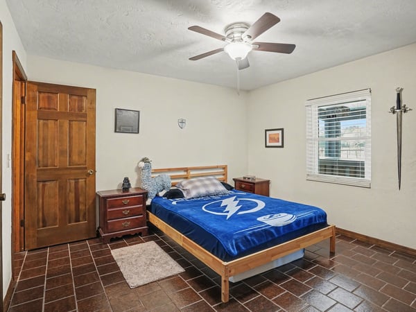 First bedroom, located off of the foyer, with has two doors to access it. One door is across from the guest bathroom for easy accessibility, while the other door is off of the foyer.