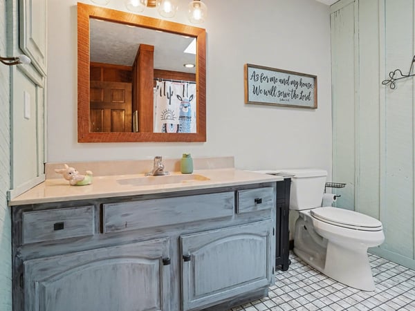 Guest bathroom which has a newer skylight to allow for optimal natural light!