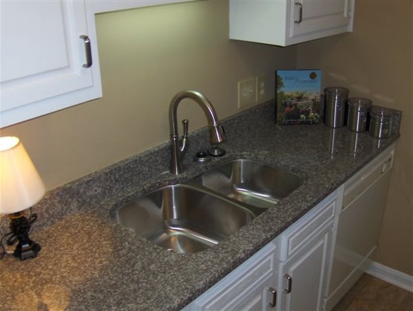 Bright kitchen featuring modern appliances, ample counter space, and a functional layout perfect for culinary enthusiasts.