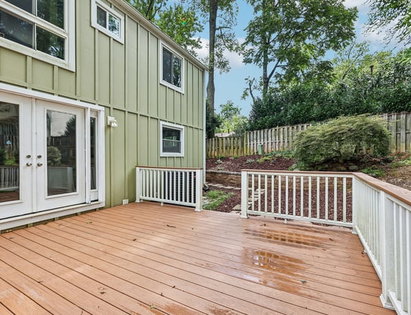 Spacious deck overlooking a lush yard, perfect for outdoor gatherings and creating lasting memories.