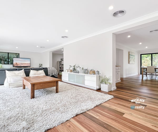Bright and airy living space with natural light, featuring hardwood floors and an inviting, open layout.