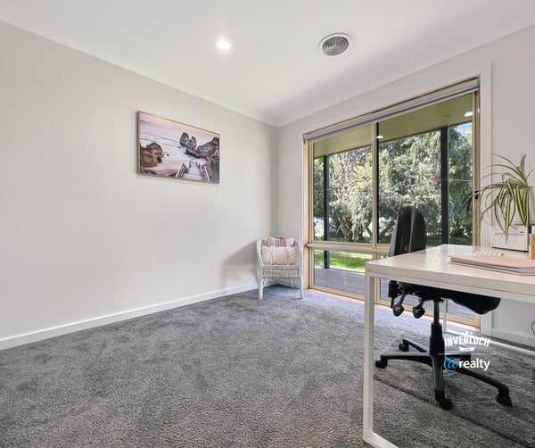Bright and spacious room with large windows, offering peaceful views and ample natural light for productivity.