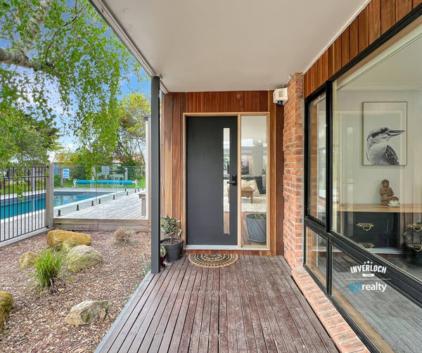 Discover modern living with a seamless indoor-outdoor flow, featuring a sleek entry and inviting surroundings.