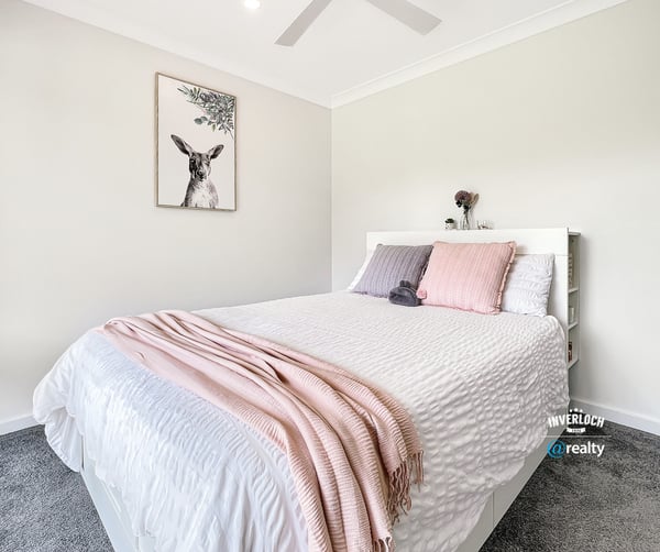 Bright and inviting bedroom featuring modern decor, soft textiles, and a peaceful atmosphere for relaxation.