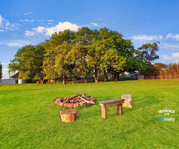 Expansive outdoor space featuring a cozy fire pit area, perfect for gatherings and relaxation.