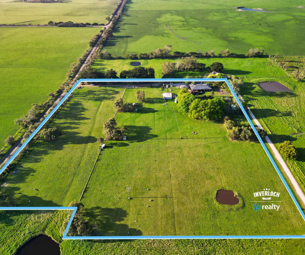 Spacious rural property featuring vast grassy fields, multiple water features, and expansive potential for development.