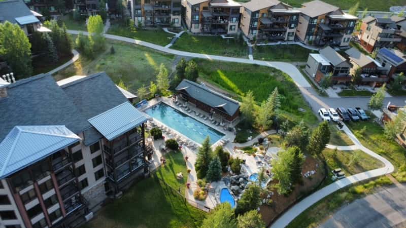 37 of 42. This aerial view showcases the pools at Trailhead Lodge, amenities available to Wildhorse Meadows homeowners and guests.