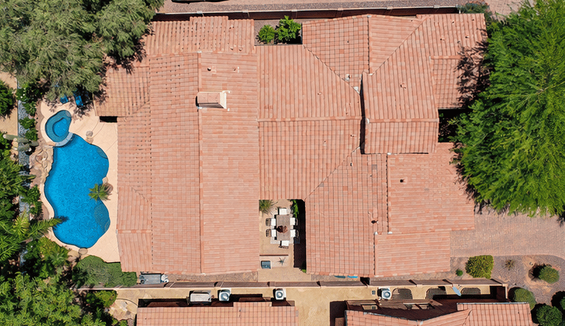 67 of 72. This aerial image showcases the home's roofline, private courtyard, custom pool, and overall property layout, highlighting exceptional outdoor amenities and thoughtful design.