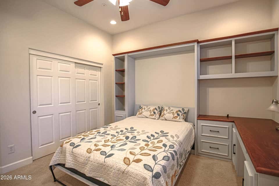 36 of 72. Featuring custom built-in cabinetry, integrated shelving, a desk workspace, plush carpeting, and generous closet space, this room easily adapts to your lifestyle needs.